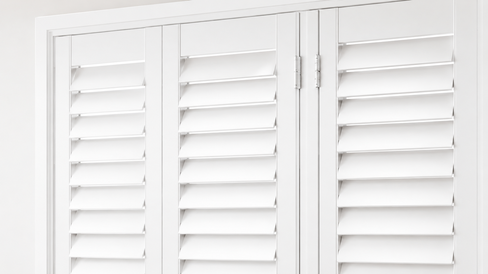 Living room windows fitted with plantation shutters